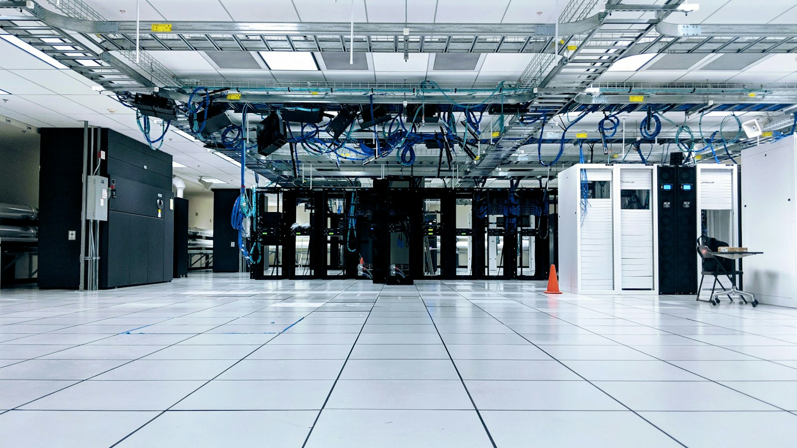 Server racks and network cabling inside a data center